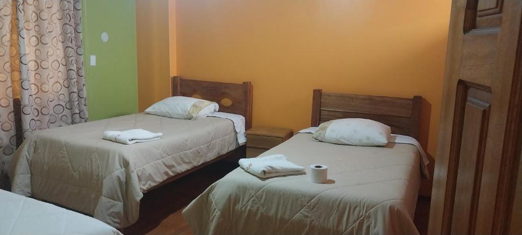 Postel nebo postele na pokoji v ubytování HOSTAL JOYA ANDINA