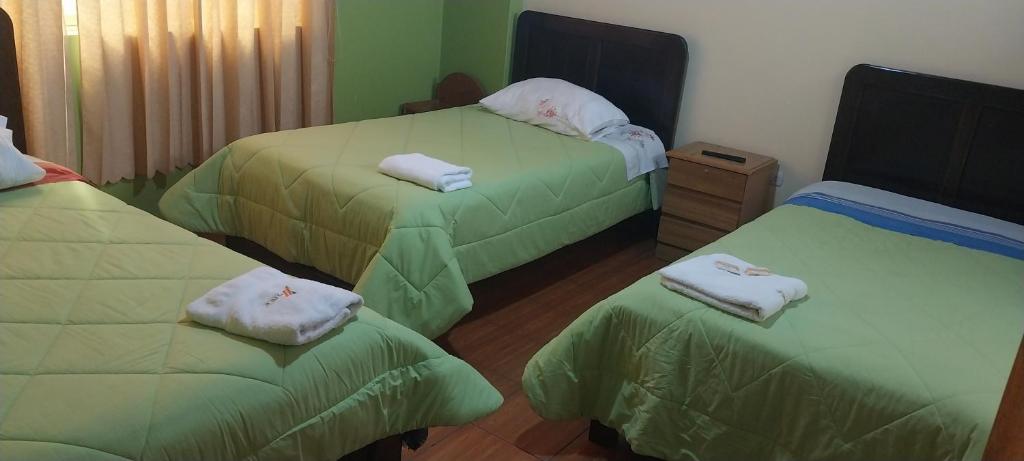 Postel nebo postele na pokoji v ubytování HOSTAL JOYA ANDINA