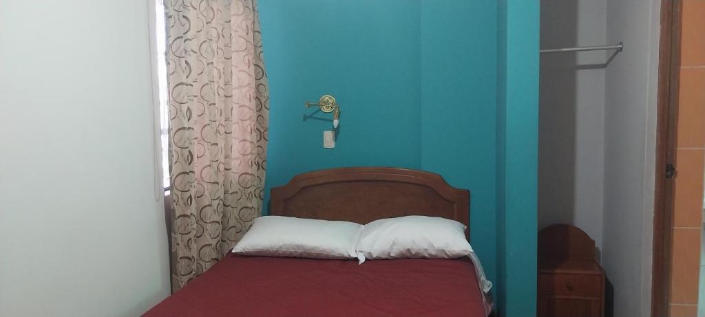 Postel nebo postele na pokoji v ubytování HOSTAL JOYA ANDINA