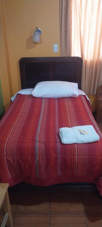 Postel nebo postele na pokoji v ubytování HOSTAL JOYA ANDINA