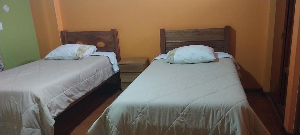 Postel nebo postele na pokoji v ubytování HOSTAL JOYA ANDINA