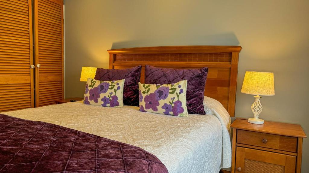 Postel nebo postele na pokoji v ubytování Hotel Puerta del Lago