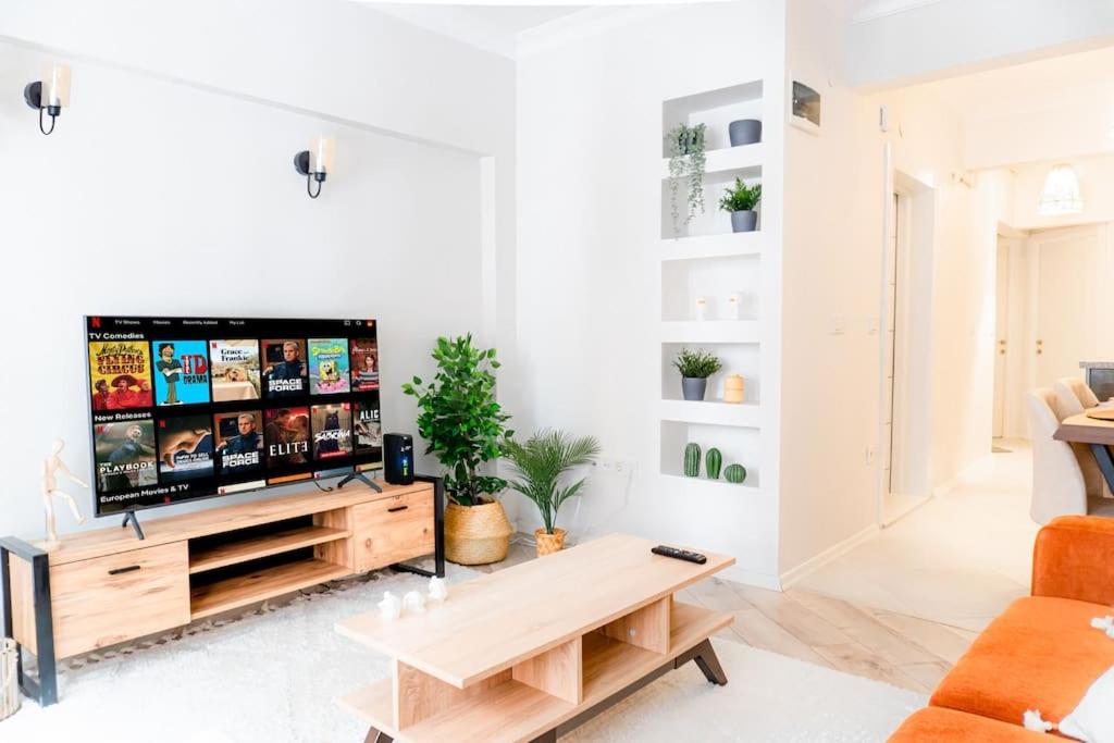 a living room with a tv and a table at The most popular Centre Of Kadikoy in Istanbul