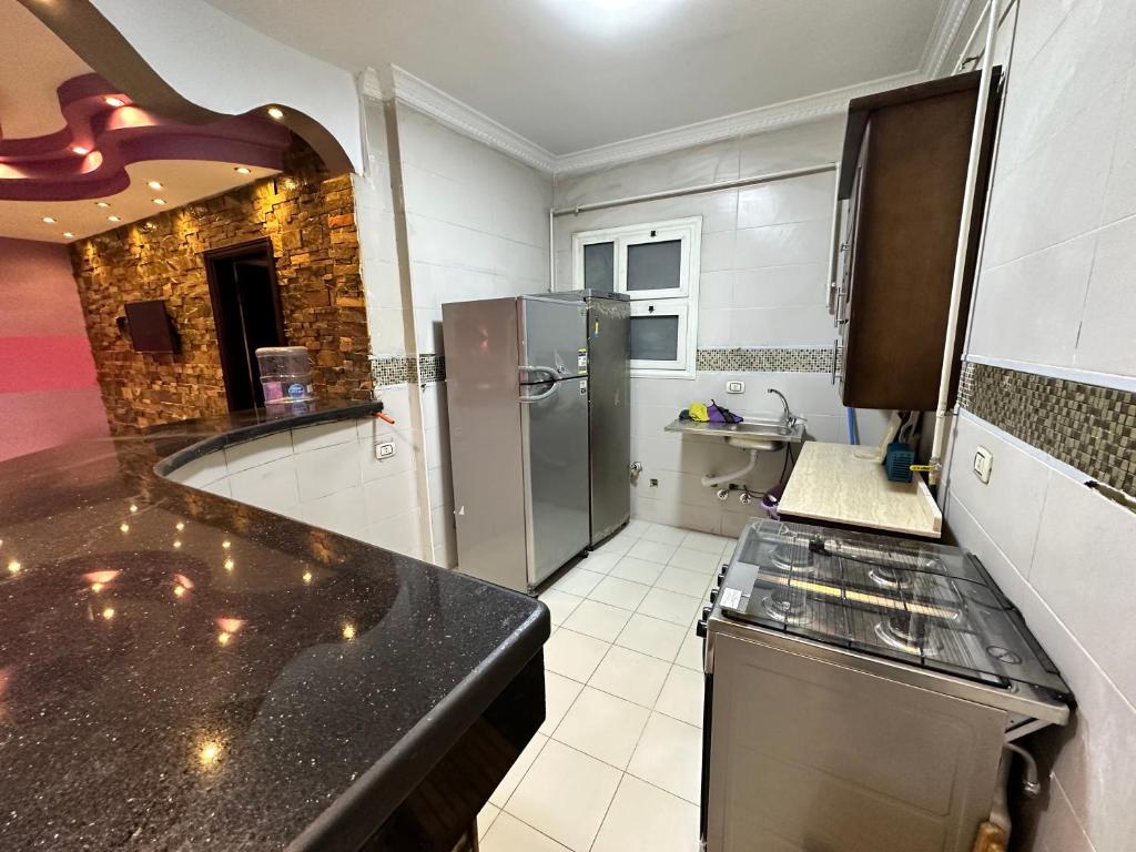 Kuchyň nebo kuchyňský kout v ubytování Misr Al Gadedah Rooms