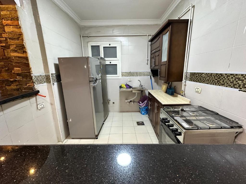 Kuchyň nebo kuchyňský kout v ubytování Misr Al Gadedah Rooms