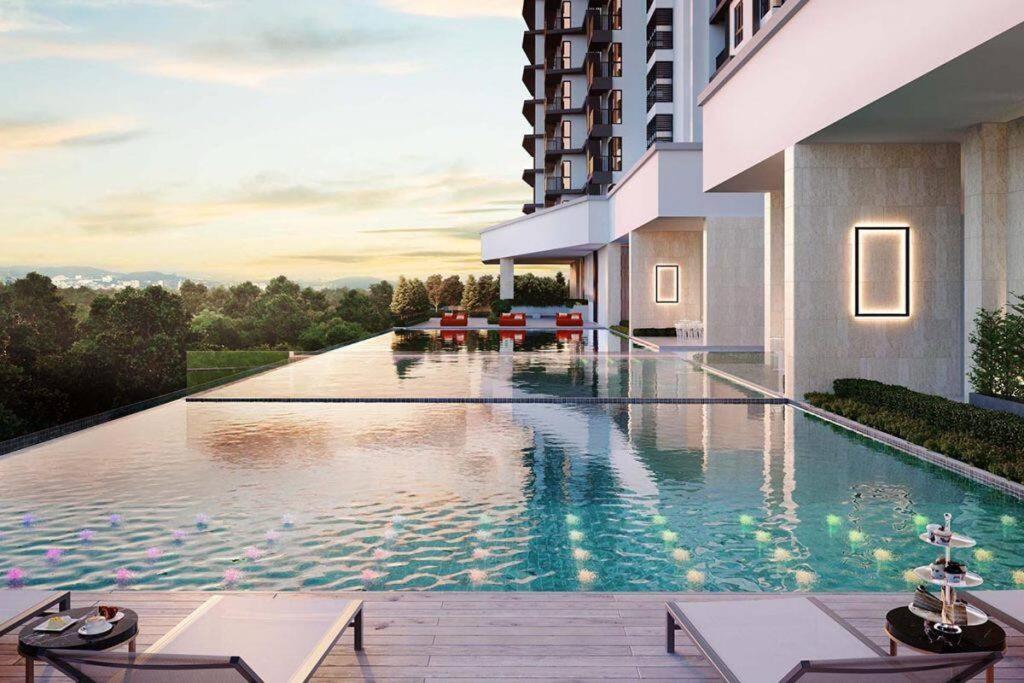 a hotel swimming pool with a view of a building at Mont kiara Warmly Home A-29-06 in Kuala Lumpur