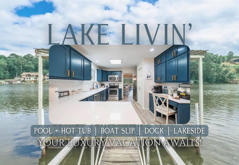 a large kitchen with blue cabinets on the water at Lake Livin' in Hot Springs