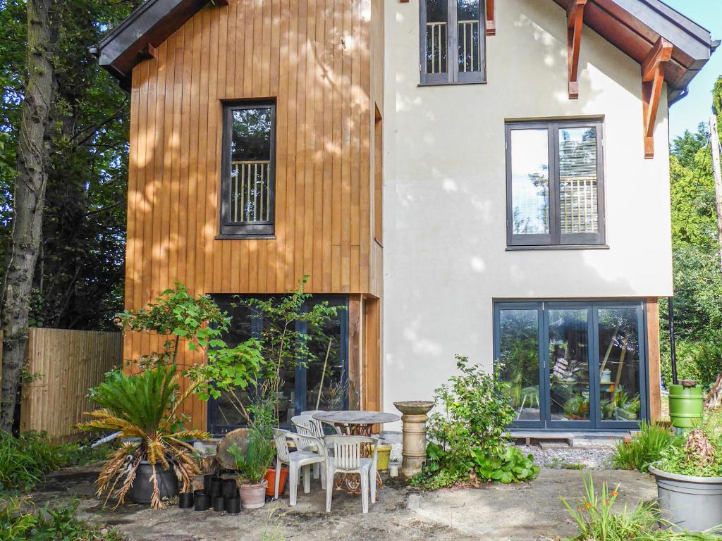 a house with a table and chairs in front of it at Oakmere in Fareham