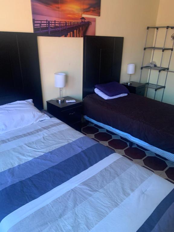 Cama ou camas em um quarto em Estrada House