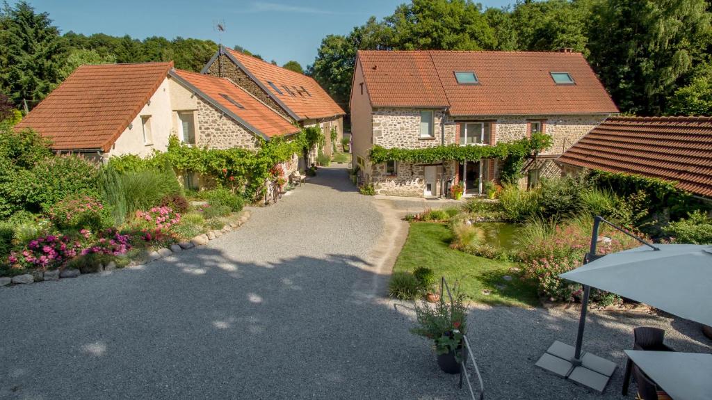 an overhead view of a house with a garden at Domaine de la Jarrige in Saint-Vaury