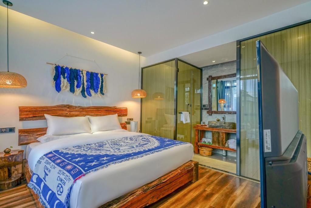 Postel nebo postele na pokoji v ubytování Xisu Garden Inn