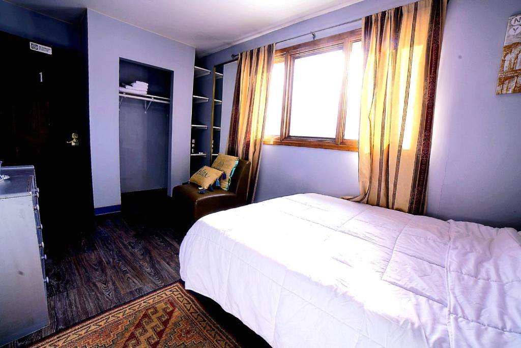 Postel nebo postele na pokoji v ubytování ShaligoHomes