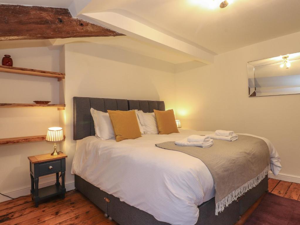 Postel nebo postele na pokoji v ubytování 3 Settlebeck Cottages