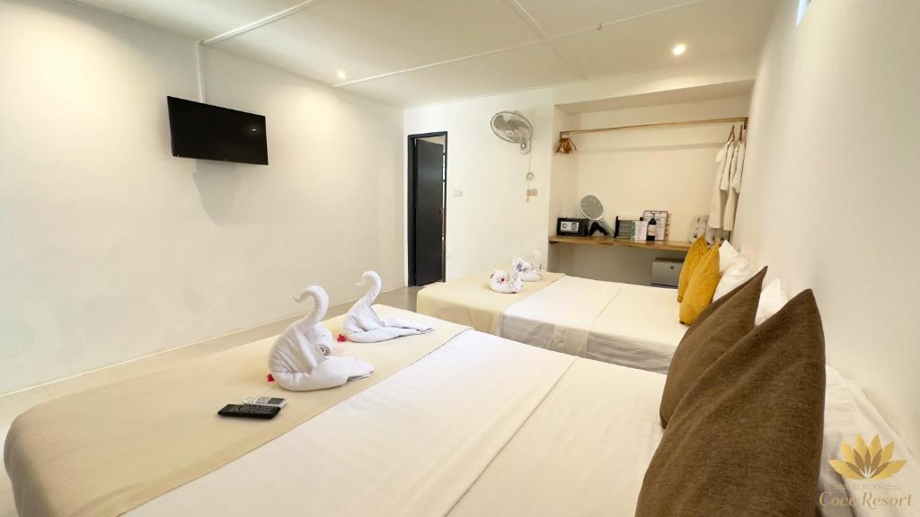 Postel nebo postele na pokoji v ubytování El Nido Coco Resort