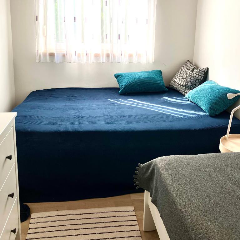 Postel nebo postele na pokoji v ubytování Ferienhaus Seeblick
