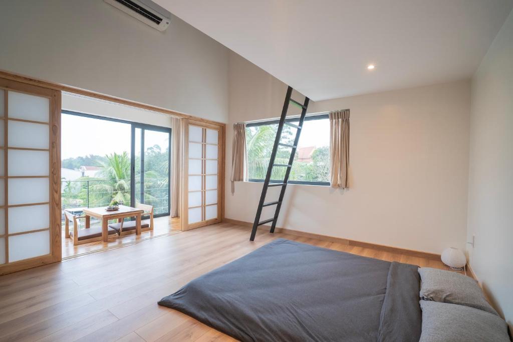 Giường trong phòng chung tại Hajime Homestay Hue