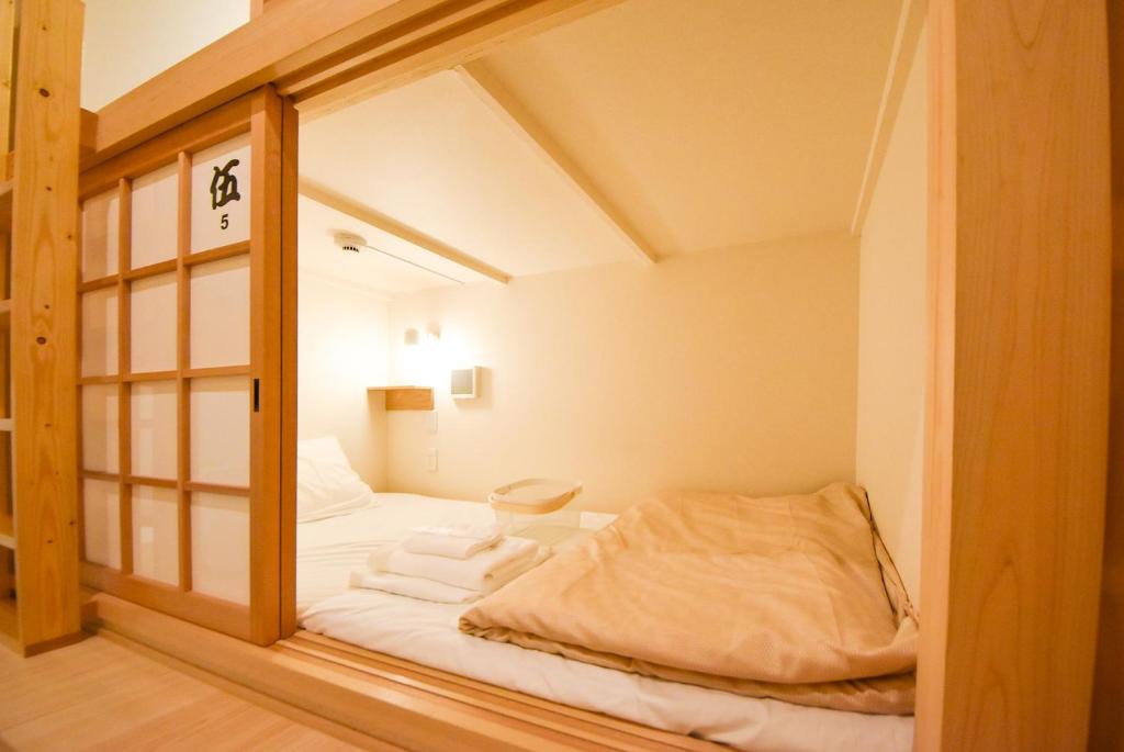 Letto o letti in una camera di Comfy Stay Sarusawaike