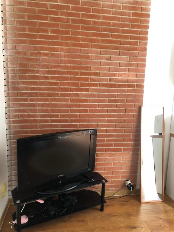 TV a/nebo společenská místnost v ubytování Logement entier