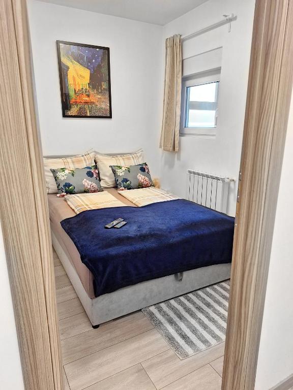 Posteľ alebo postele v izbe v ubytovaní APARTMENT NEVERA