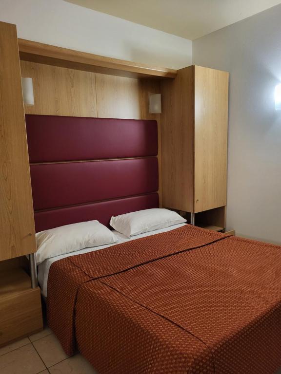 Postel nebo postele na pokoji v ubytování Hotel Mondial