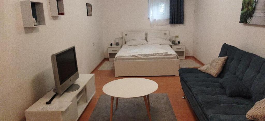 Postel nebo postele na pokoji v ubytování Barany Pécs