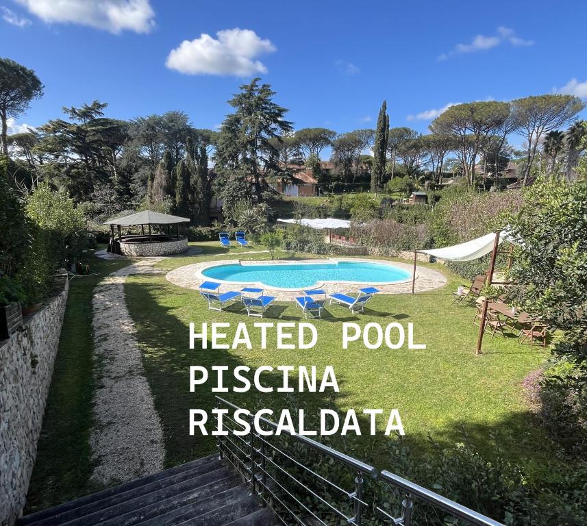 a sign that reads heated pool piscina regalida at Villa Roma Open Space - Private heated pool & Mini SPA - in Rome