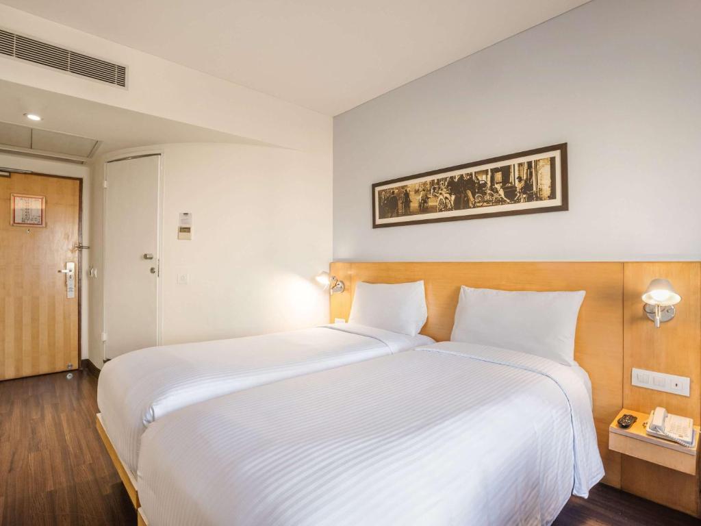 Postel nebo postele na pokoji v ubytování ibis Chennai Sipcot - An Accor Brand