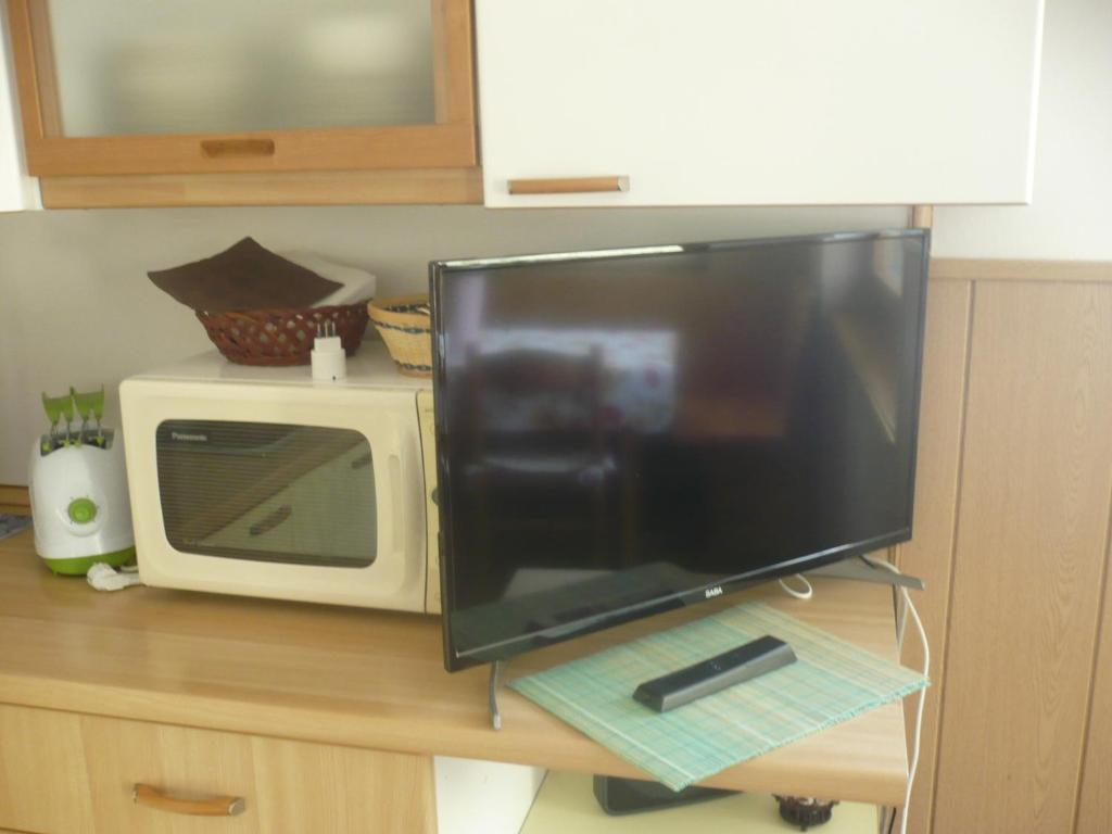 TV a/nebo společenská místnost v ubytování Appartamento Michela