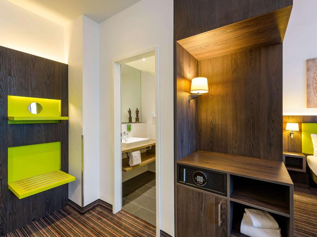 Postel nebo postele na pokoji v ubytování Ibis Styles Trier