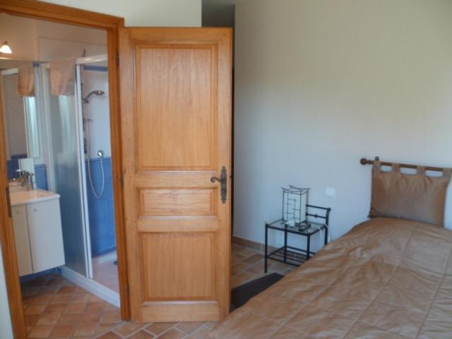 Postel nebo postele na pokoji v ubytování Chambre d'hôtes "La Bastide des Eucalyptus"