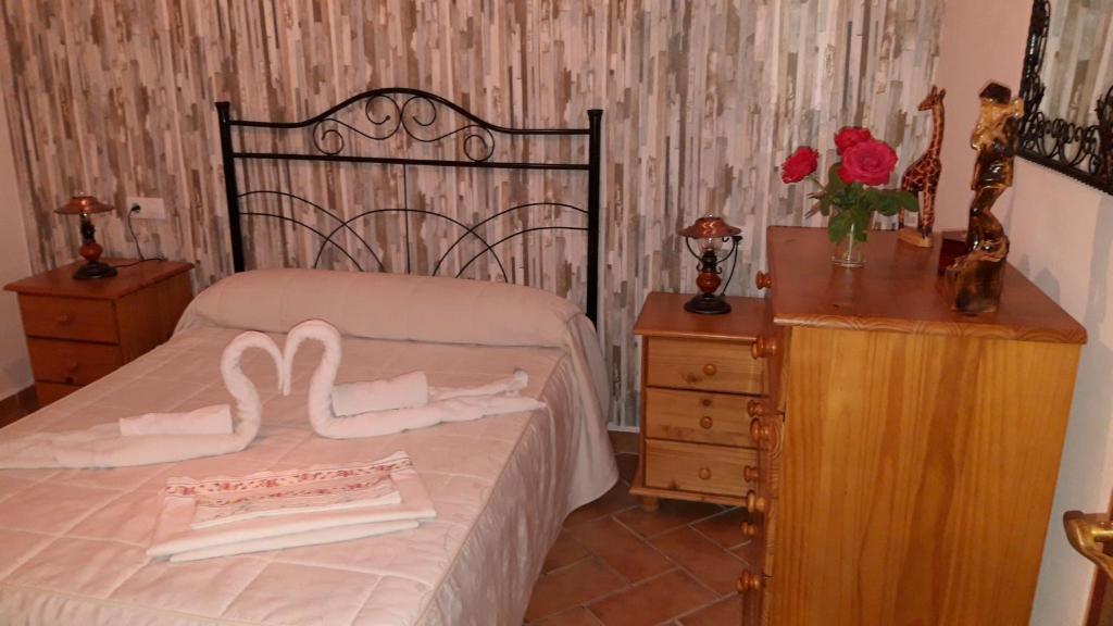 Postel nebo postele na pokoji v ubytování Oasis Aguzaderas