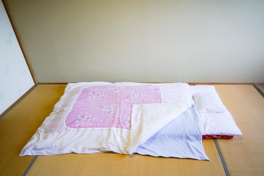 Postel nebo postele na pokoji v ubytování 本栖湖畔 民宿 浩庵 Kouan guesthouse at Lake Motosu