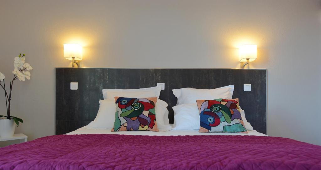 Postel nebo postele na pokoji v ubytování Hotel Les Eucalyptus