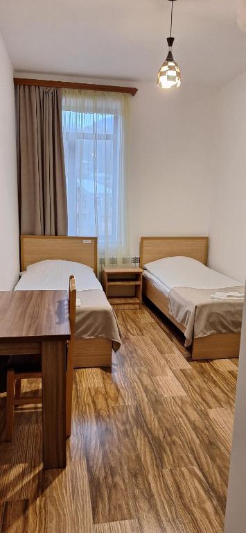Postel nebo postele na pokoji v ubytování Mthnadzor