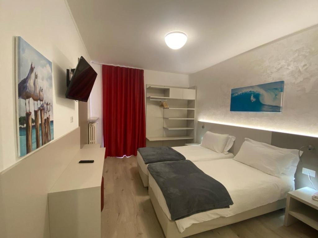 Postel nebo postele na pokoji v ubytování Hotel Angelini