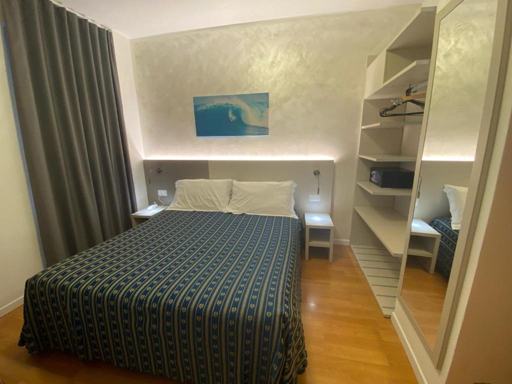 Postel nebo postele na pokoji v ubytování Hotel Angelini