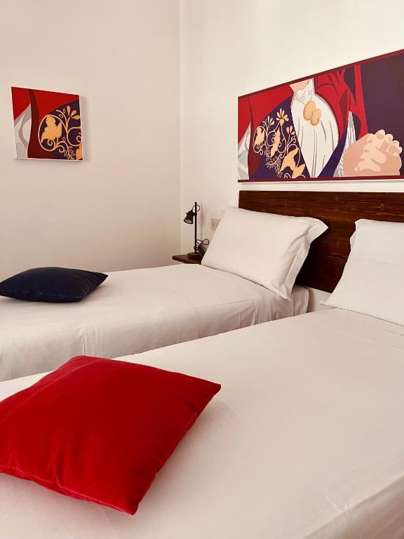 Postel nebo postele na pokoji v ubytování Carrales Guest House