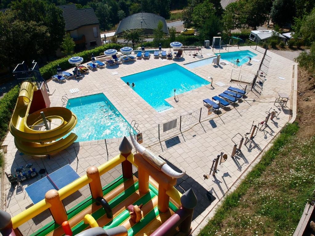 an overhead view of a swimming pool with a slide at Mobihome premium 4p 2 chambres 2 salles de bain in Villefort