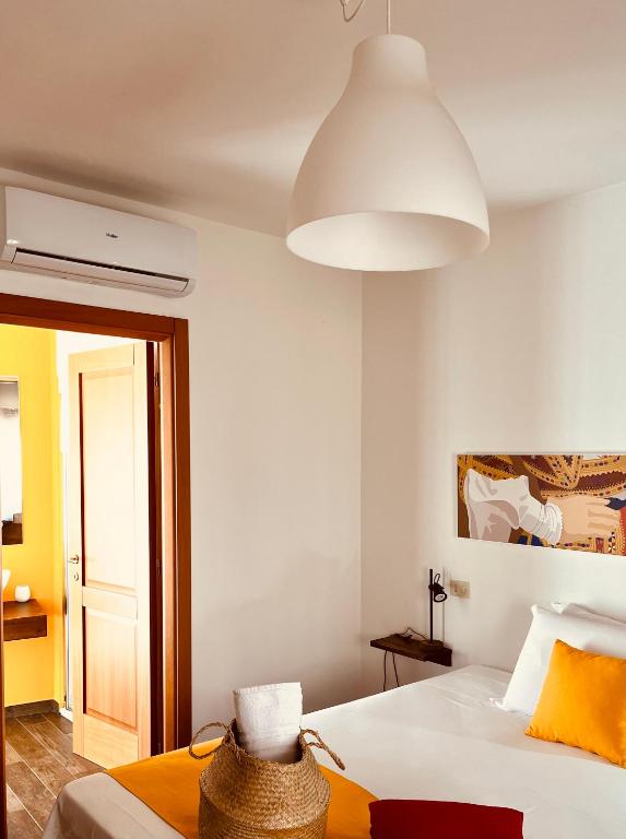 Postel nebo postele na pokoji v ubytování Carrales Guest House
