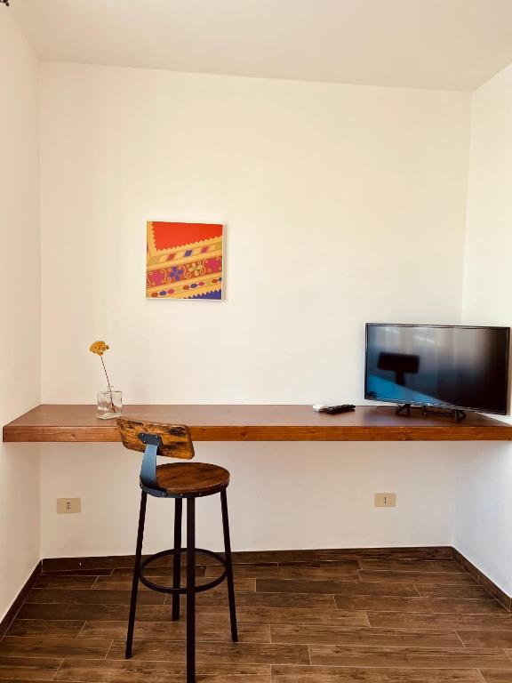 TV a/nebo společenská místnost v ubytování Carrales Guest House