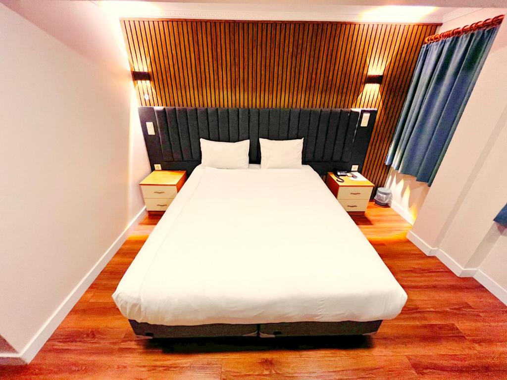 Postel nebo postele na pokoji v ubytování Naila Hotel