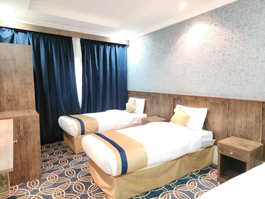 Ein Bett oder Betten in einem Zimmer der Unterkunft فندق الششة