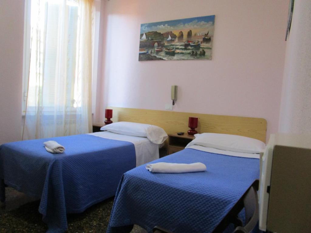 Postel nebo postele na pokoji v ubytování Hotel Guesthouse MASSENA
