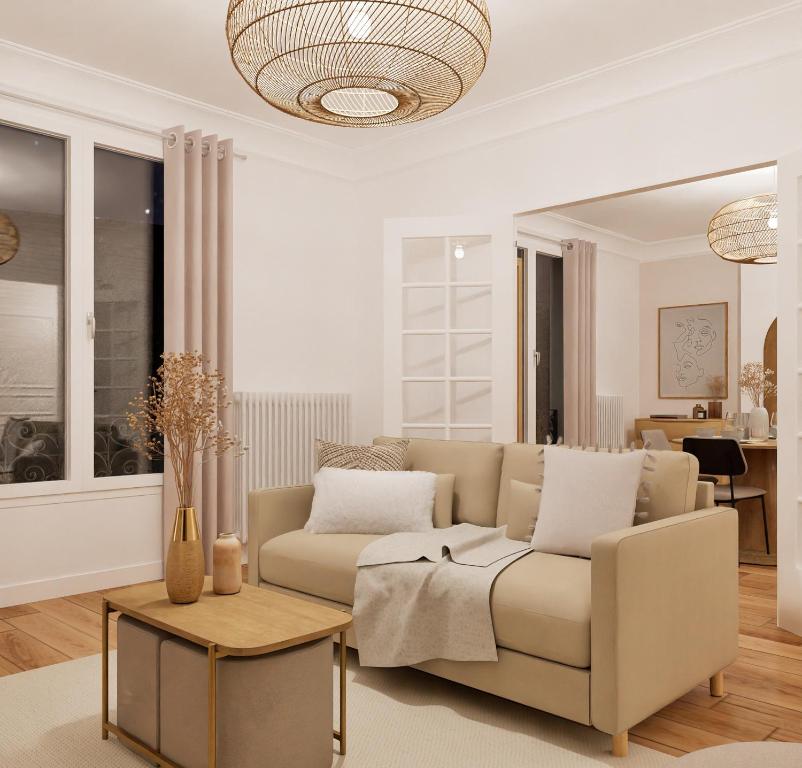 a living room with a couch and a table at Appartement de luxe à côté du stade de France - JO 2024- Et avec accès à Paris en 10 mn in Enghien-les-Bains