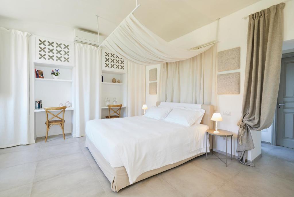 Posteľ alebo postele v izbe v ubytovaní Leonardo Trulli Resort