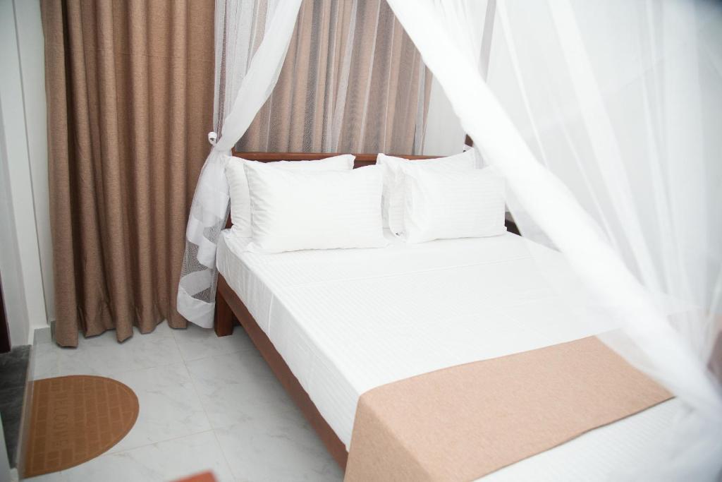 Postel nebo postele na pokoji v ubytování Tango Sunrise Villa