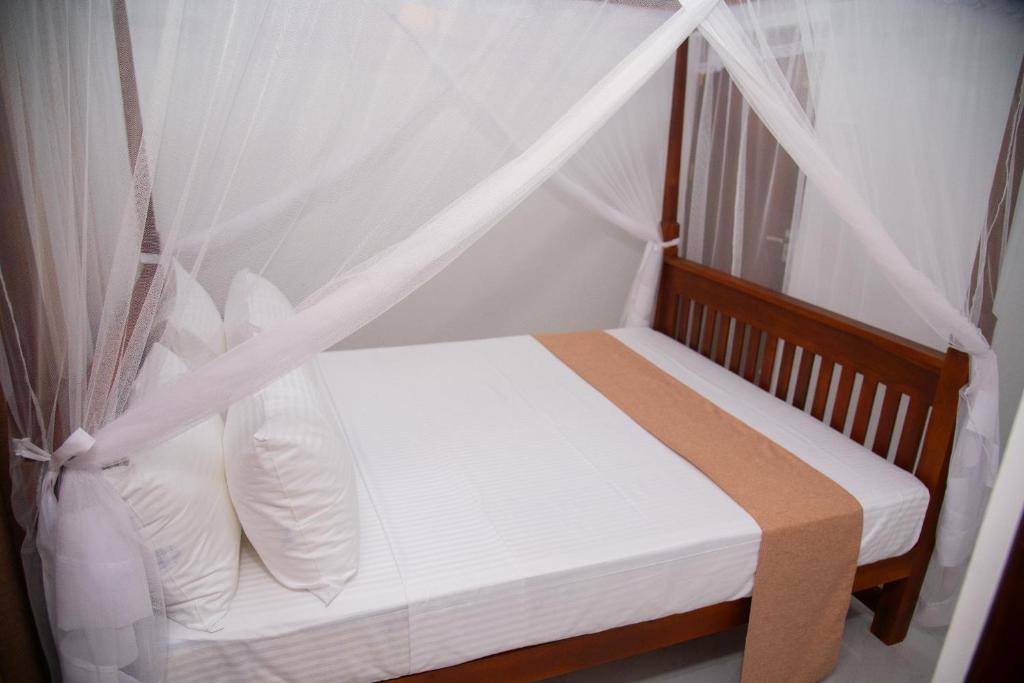 Postel nebo postele na pokoji v ubytování Tango Sunrise Villa