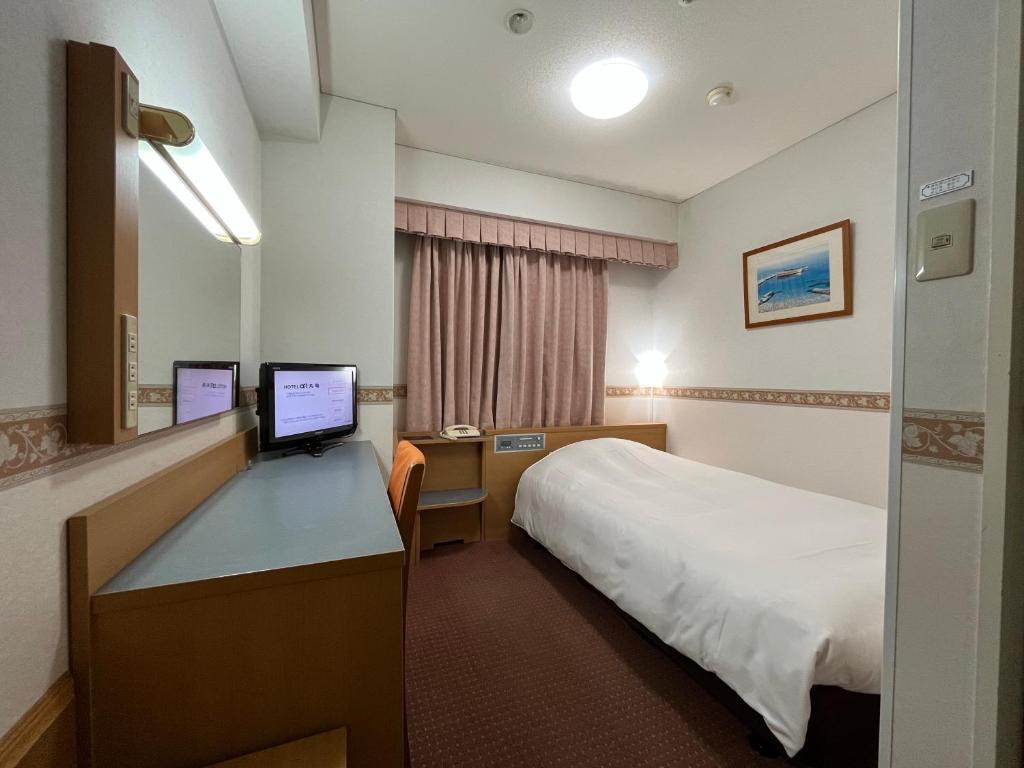 Postel nebo postele na pokoji v ubytování Hotel Alpha-One Marugame
