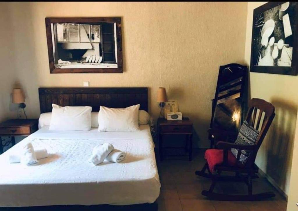Postel nebo postele na pokoji v ubytování Guesthouse Axieros