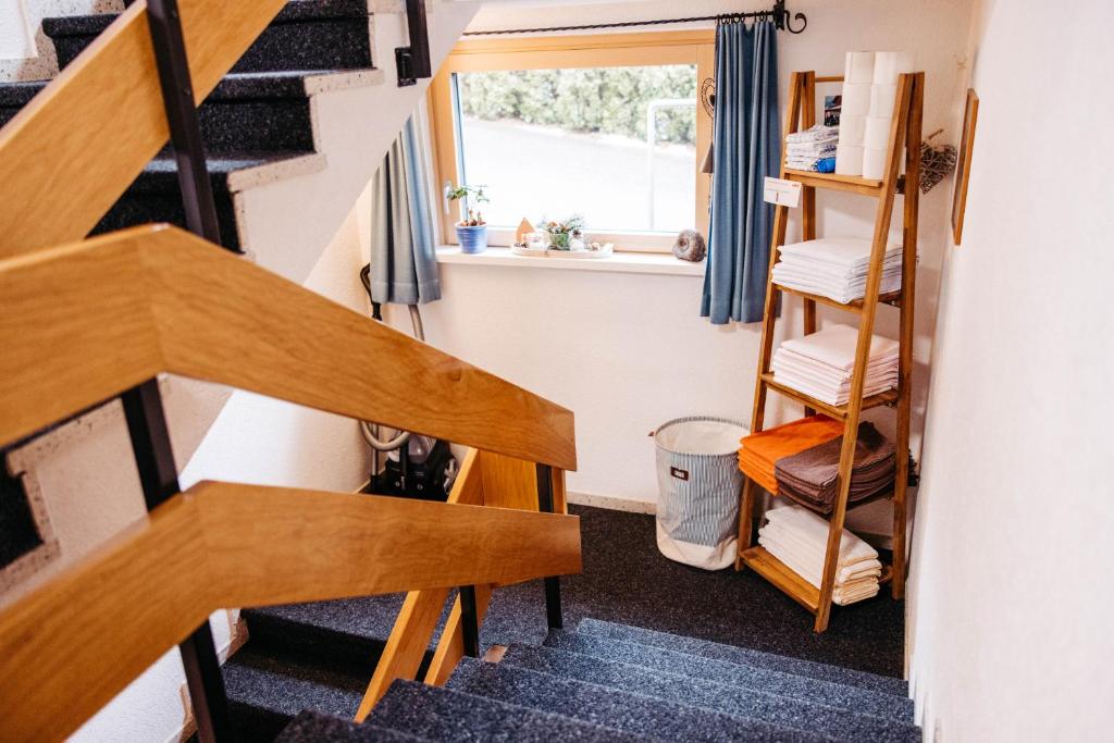 a staircase in a tiny house with a window at Haus Kella-Egg in Brand